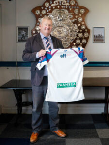 Alun Williams CEO Swansea Building Society with Swansea RFC shirt for 23-24 season