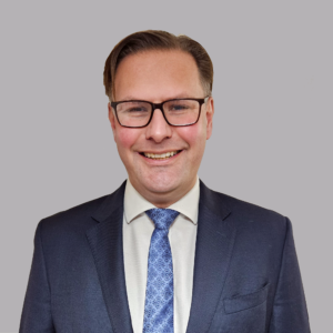 Man standing in front of a grey background