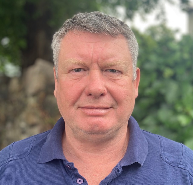 Headshot of a man outside