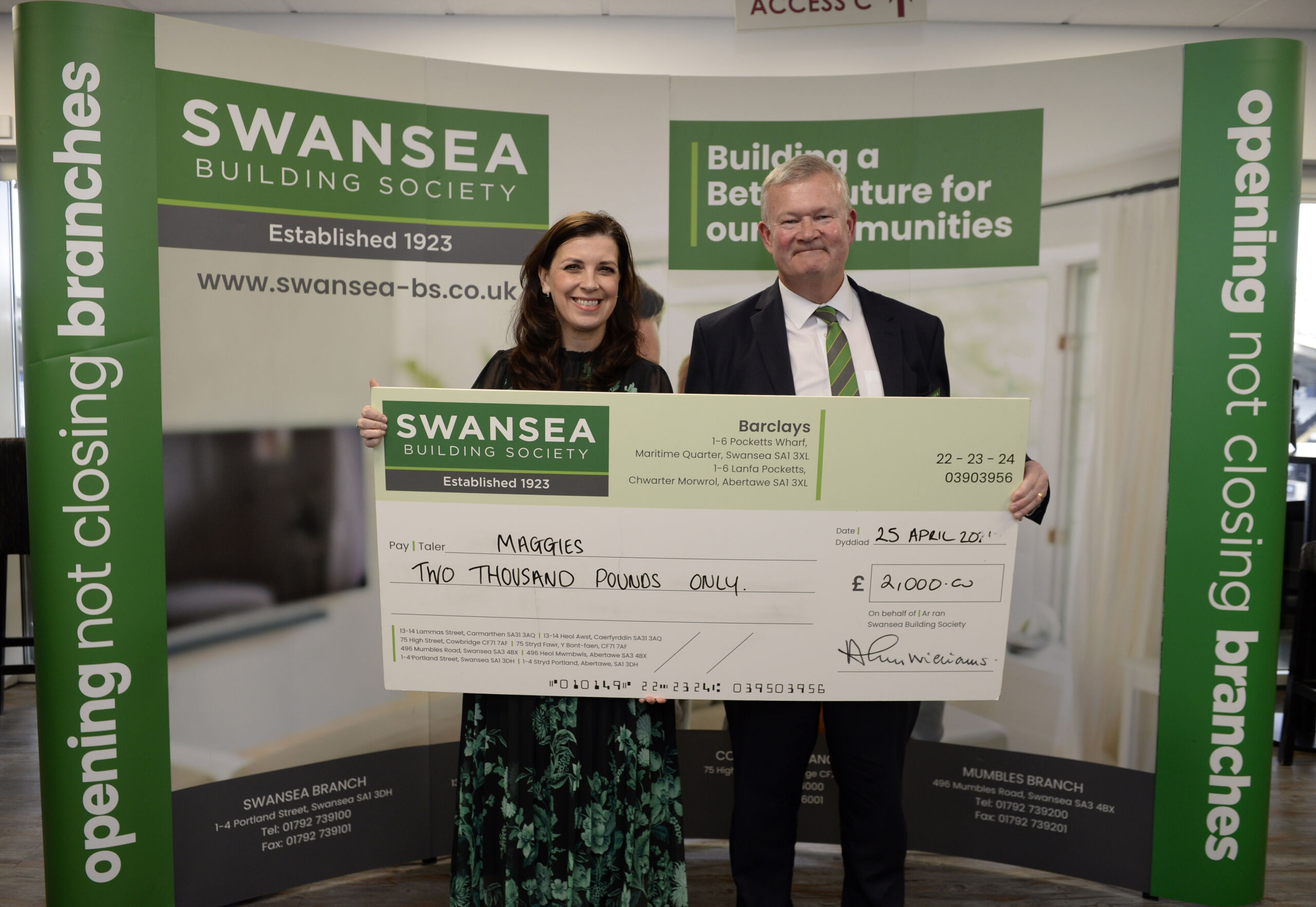 Alun Williams (right) presents a cheque for £2000 to Lucia Osmond (left) of Maggies.