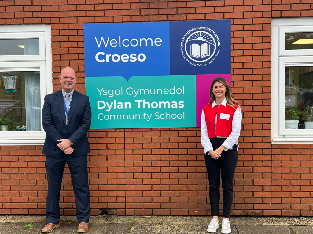 Paul Davies and Rachel Flanagan stood outside Dylan Thomas Community School.