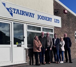 The team at Premier Forest Products and Stairway Joinery Ltd stood outside Stairway Joinery Ltd.