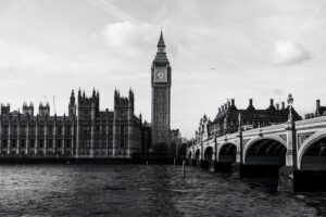 The big ben clock tower towering over the city of london